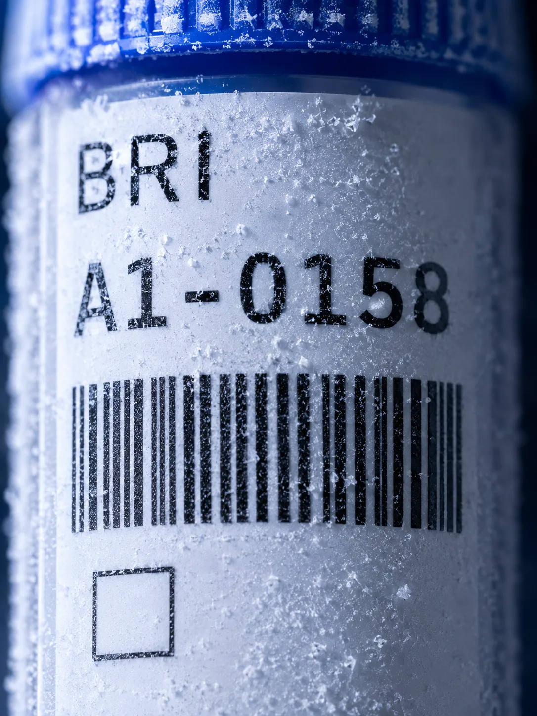 A frost-covered sample vial labelled BRI A1-0158 with a barcode.